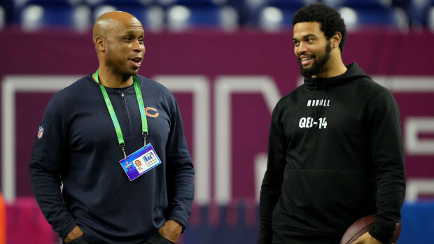 Caleb Williams talks with Bears quarterbacks coach Kerry Joseph at the combine.